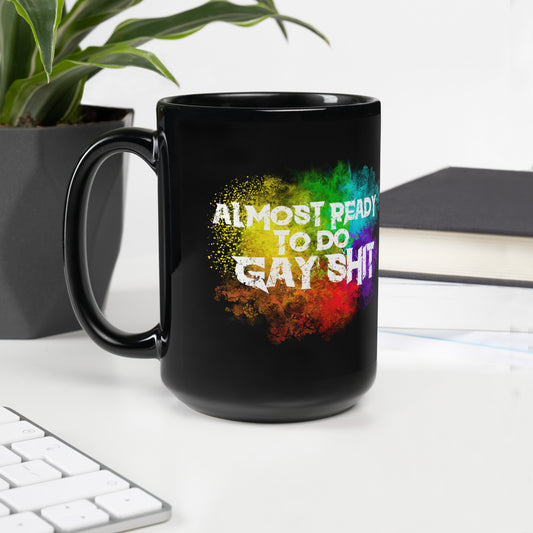15oz black glossy mug by Moody Booty Apparel, showcasing the text 'Almost Ready To Do Gay Shit.' Pride-themed LGBTQ coffee mug, perfect for LGBTQ individuals and gay pride enthusiasts.